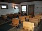 Virtual Tour of the Schoolhouse: Students' single desks (view of classroom from near the blackboard)