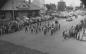A band marches past the C.P.R. station during a parade