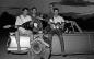 Rock band in and on a small convertible: Lyle Braunswarth, Barry Fredell, Peter Dale, unknown