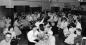 People square dancing in the banquet room of the Memorial Centre