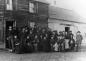 Group of High River pioneers in front of Buck Smith's Stopping House, the morning after a dance.