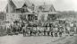 People gathering to celebrate Peace Day in front of the Presbyterian manse.