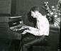 Music teacher Doug Goldsmith at organ keyboard