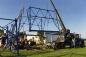 A large crane helps reassemble the Discovery Derrick in Redwater