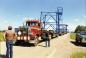 Massive trucks line up to haul the Discovery Derrick into Redwater.