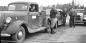 The Trail Blazers crossing the North Saskatchewan River on the ferry.  Bill Fisher sitting in truck.