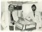 Dr. Alan White (left) with Dr. Corley in the Children's Ward at Sundre Hospital.