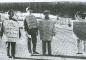 Nurses carry pickets signs near the hospital grounds.