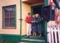 Roger Grimes and daughters of Richard Hiscock Jr. cutting ribbon at opening of Hiscock House Exhibit