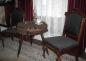 Side table and chairs located in the parlour