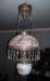 Oil lamp hanging from the ceiling in the dining room