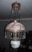 Oil lamp hanging from the ceiling in the dining room