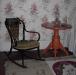 Rocking chair and side table located in Florence's bedroom