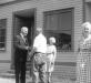 Will shaking hands with a man outside the Shop.