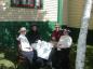 Ladies having tea outside the Hiscock House