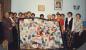 Quilting Guild members with quilt. 