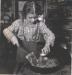A young girl cooking on the Shilly Shally stove