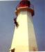 The Lighthouse Keeper scales the lighthouse to paint the outside