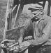 A fisherman splitting, cleaning and storing fish to sell locally or in Amherst. 