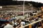 Crowds and bleachers for invited guests