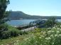 Cape Breton and Central Nova Scotia Railway train crosses the Canso Causeway and Canal bridge