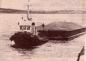 Tug with barge of gravel from Cape Porcupine Quarry approaching the Canso Canal