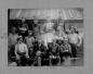 Quarry workers posing in front of Quarry office. Names around picture border.