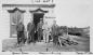 Mr. Lyle, quarry owner standing, in front of the guarry office about 1935.