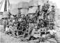 Group of scabblers, quarrymen who use picks to square up stone for shipment.