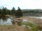 Dykes just above water line during a spring flood on Dewar River