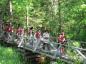 Re-enactment of twenty British and New England soldiers on a march through the woods to Remsheg