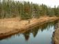 Jim Reeves measures site of small aboiteau still in place after nearly 300 years