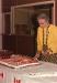 Jennie Charman, former school teacher, cutting the cake for the Bicentennial Celebration