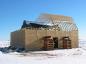 The rafters of the protective barn are mounted to the walls.