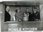 R.B. Bennett with Queen Elizabeth in a mobile kitchen