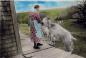 Mrs. Lennox feeding goats