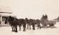 Pioneers use a tank wagon to haul water.