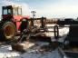 Horse drawn grader now pulled by a tractor.