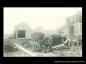 Wreckage, including out buildings and an automobile behind a house on 14th avenue.