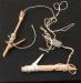Fish hooks made from small twigs, and weight.