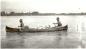 Robert Tobacco and Doug Durkin paddling a canoe on the Saskatchewan River.