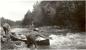 Robert Tobacco and Harold Wells maneuvering their canoe through Tracking Rapids on the Goose River.