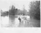 Women standing in the flood waters