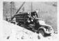 Harry Ostendorf and Bill Vigne loading logs on Harry's logging truck. 