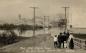 People watching The 1916 Spring Flood of the Elk River Fernie BC Skating Rink in middle right