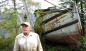 GUNNAR BESIDE HULL OF HIS BOAT 'ECHO' Sechelt Inlet in background