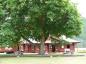 The ninety year-old maple tree shades a grassy picnic area of the Kettle River Museum grounds