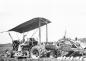 Hans Hoffmann running the ditcher in a field, possibly in Sea Island.