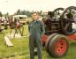 Hans standing in front of an engine at an engine show.