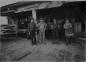 Four men at the Emerson Lumber stacking area